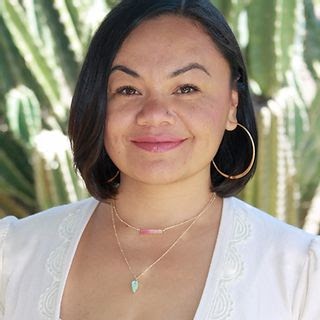 A professional headshot of a Latinx network founder.